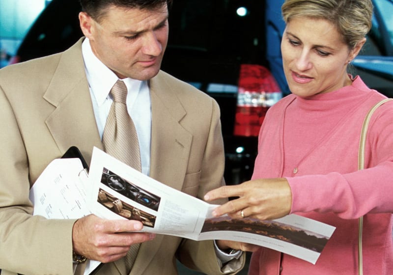 Couple looking at a printed leaflet